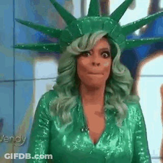 Woman With Green Hair And Green Costume, Statue Of Liberty Hat GIF