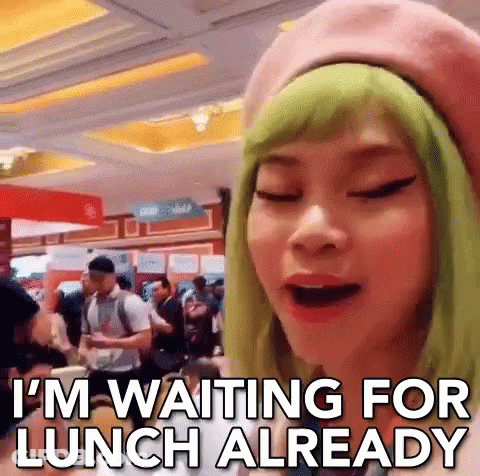 Woman With Green Hair And Pink Beret Waiting For Lunch GIF