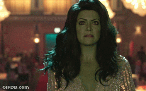 Woman With Green Hair And Silver Top GIF