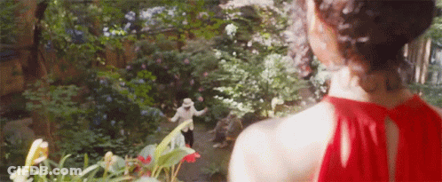 Woman With Green Hair Dancing At Grave GIF
