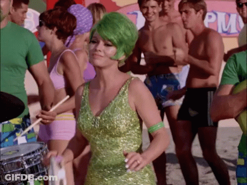 Woman With Green Hair Dancing In Front Of PM Sign GIF