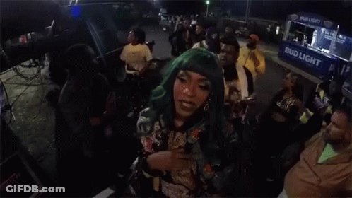 Woman With Green Hair In Front Of Food Truck GIF