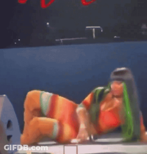 Woman With Green Hair Lying On Floor GIF