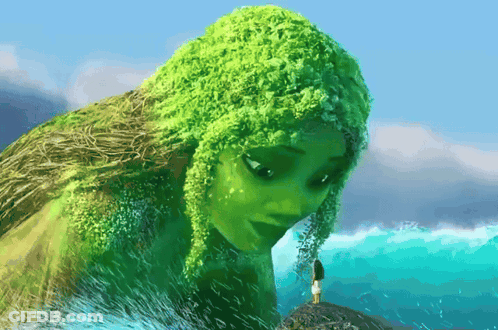 Woman With Green Hair Stands On Ocean Rock GIF