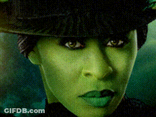 Woman With Green Makeup And Hat GIF