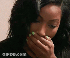 Woman With Green Nail Polish Covering Mouth GIF