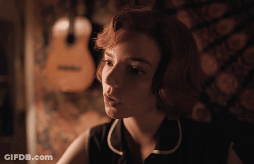 Woman With Guitar Looking At Camera GIF