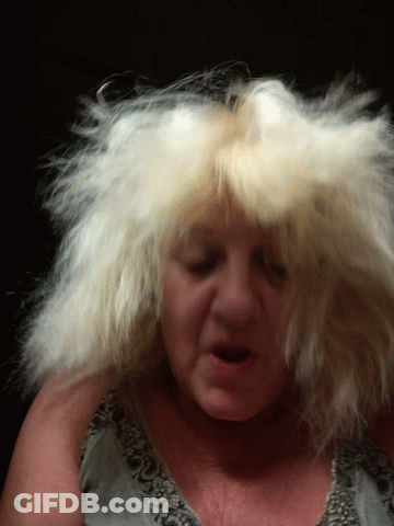 Woman With Hair Blowing In Wind GIF