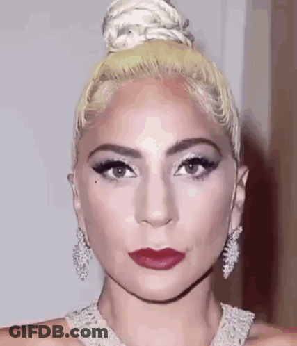 Woman With Hair Bun And Red Lipstick GIF
