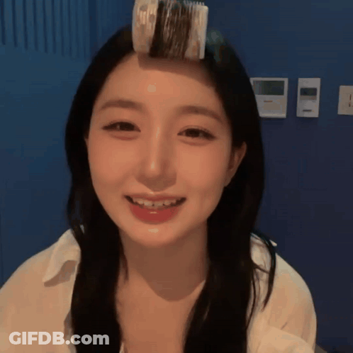 Woman With Hair Roller Smiling GIF
