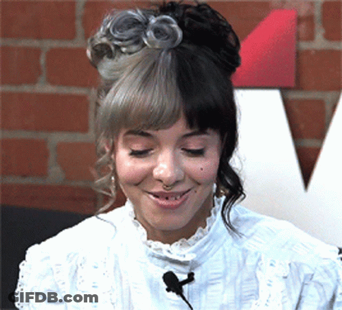 Woman With Half Gray Half Black Hair Smiling GIF