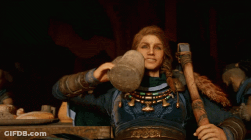 Woman With Hammer Sitting At Table With Food GIF