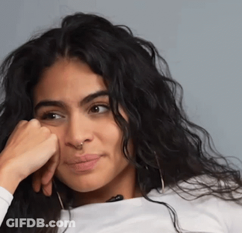 Woman With Hand On Chin Close Up GIF