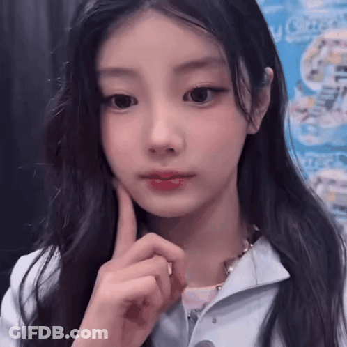 Woman With Hand On Chin Close Up GIF