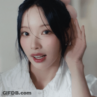 Woman With Hand On Ear Close Up GIF
