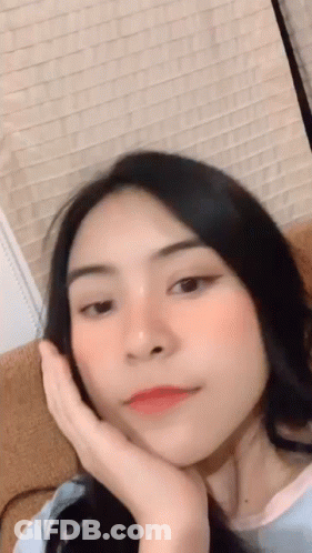 Woman With Hand On Face GIF