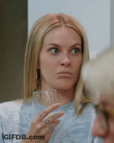 Woman With Hand Tattoo Holding Wine Glass GIF