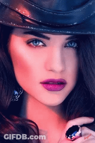 Woman With Hat And Ring And Purple Lipstick GIF