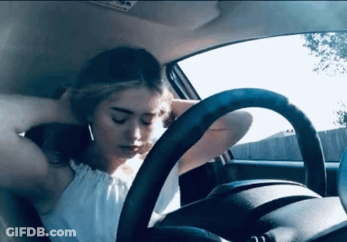 Woman With Head On Steering Wheel GIF