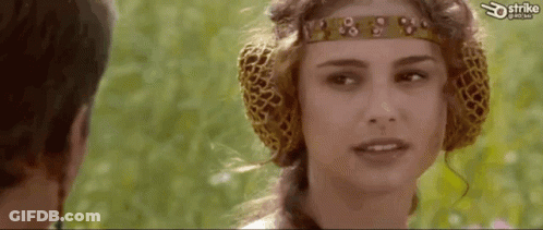Woman With Headband And Ear Muffs Looking At Man GIF
