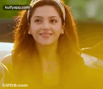 Woman With Headband And Earrings Smiling GIF