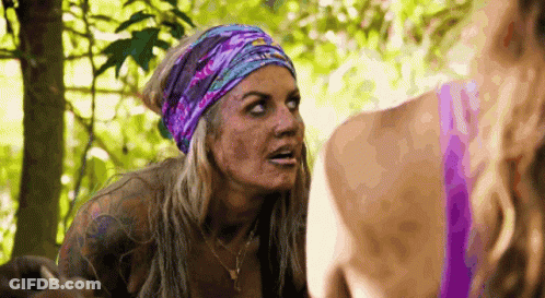 Woman With Headband And Necklace Talking To Another In Woods GIF