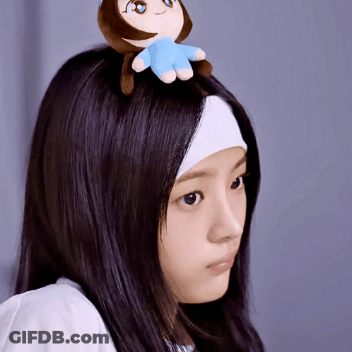 Woman With Headband And Stuffed Animal On Head GIF
