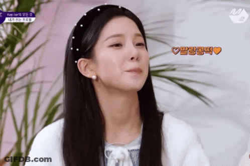 Woman With Headband Pearls And Earrings GIF