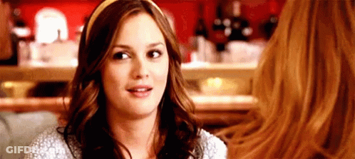 Woman With Headband Sitting With Another Woman GIF