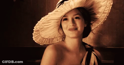 Woman With Headband Smiling In Classroom GIF