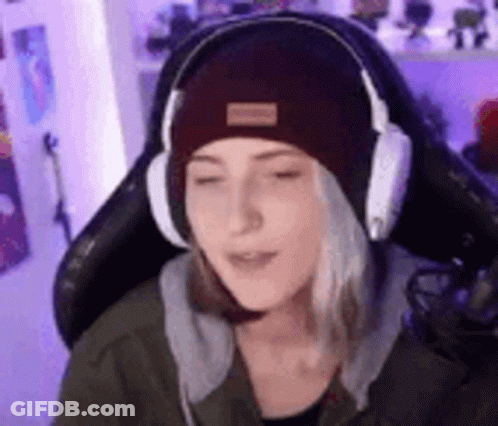 Woman With Headphones And Beanie Sitting In Chair GIF