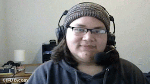 Woman With Headphones And Beanie Smiling GIF