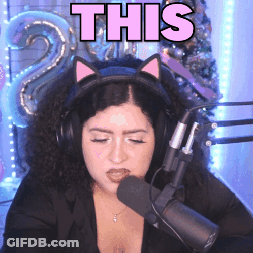 Woman With Headphones And Cat Headband Saying This GIF