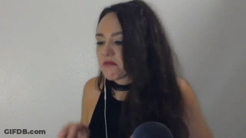 Woman With Headphones And Choker Making Funny Face GIF
