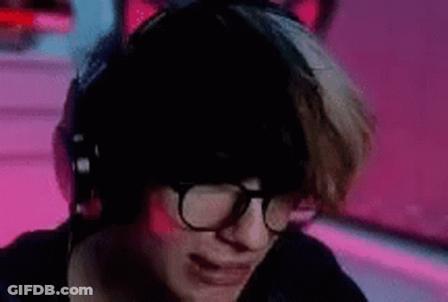 Woman With Headphones And Glasses At Computer GIF