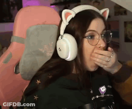 Woman With Headphones And Glasses Covering Mouth GIF