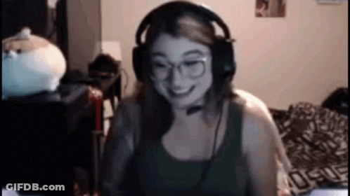 Woman With Headphones And Glasses Smiling At Computer GIF