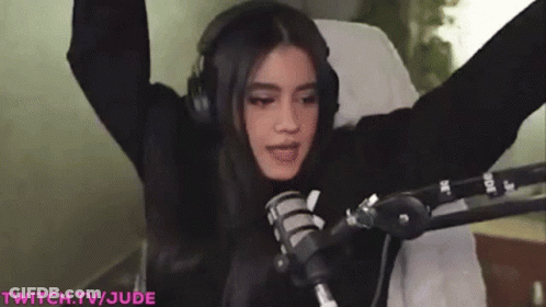 Woman With Headphones And Hands Up At Mic GIF