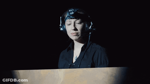 Woman With Headphones And Headlight Looking GIF