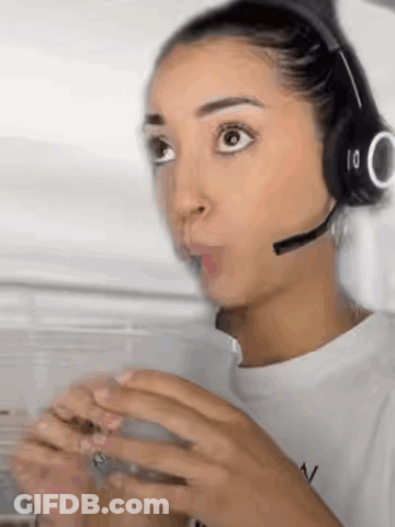 Woman With Headphones And Microphone Holding Coffee GIF