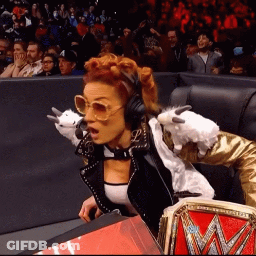 Woman With Headphones And Sunglasses Holding Stuffed Animal In Crowd GIF