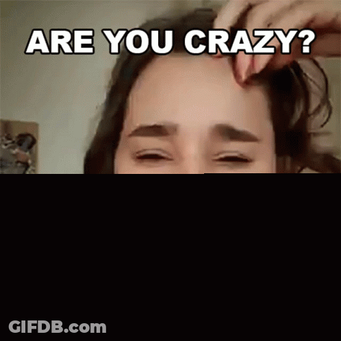 Woman With Headphones Asking If She's Crazy GIF