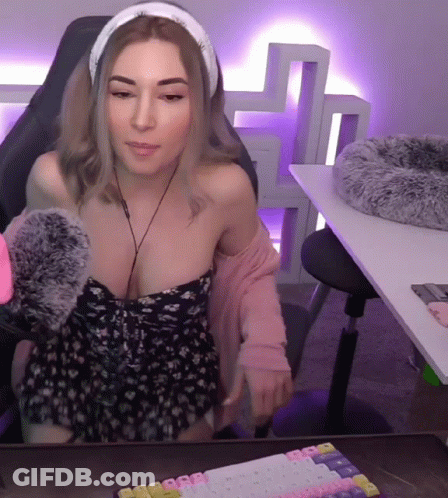 Woman With Headphones At Desk GIF