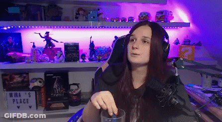 Woman With Headphones At Microphone In Purple Lights GIF