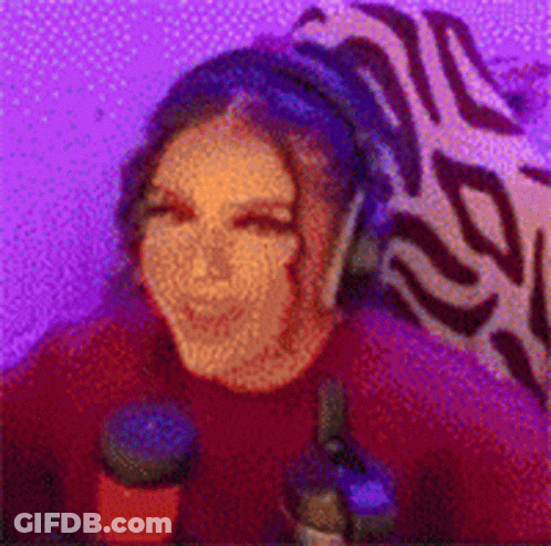 Woman With Headphones At Microphone In Purple Room GIF