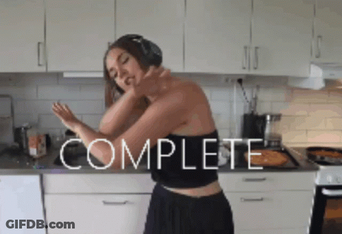 Woman With Headphones Dancing In Kitchen Saying Complete GIF