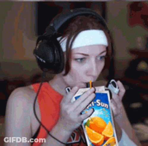 Woman With Headphones Drinking Orange Juice GIF