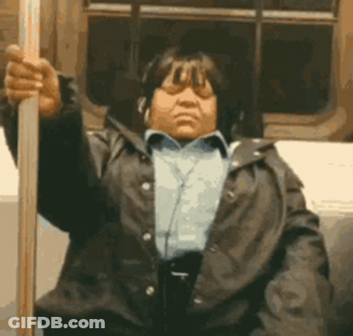 Woman With Headphones Holding Pole GIF