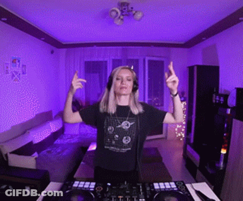 Woman With Headphones In Front Of DJ Controller GIF