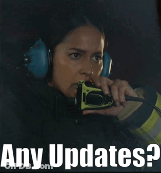 Woman With Headphones On Walkie Talkie Saying Any Updates GIF